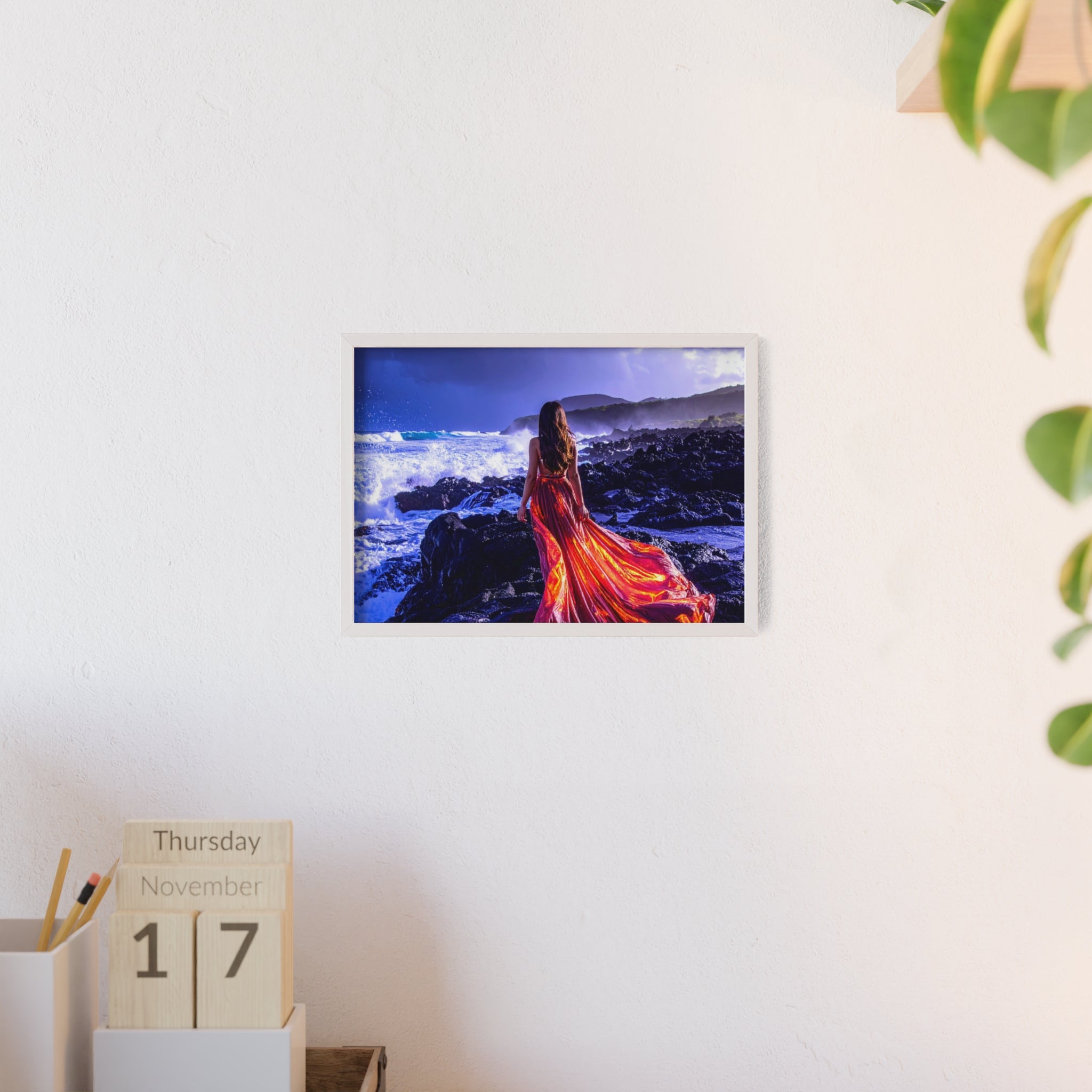 Framed Art Print — Woman in Fiery Red Dress on Rocky Shore (Wooden Frame Poster)